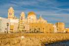 Catedral de la Santa Cruz (Cathedral of the Holy Cross) along San Sebastian Bay, Cadiz, Spain. Art Print